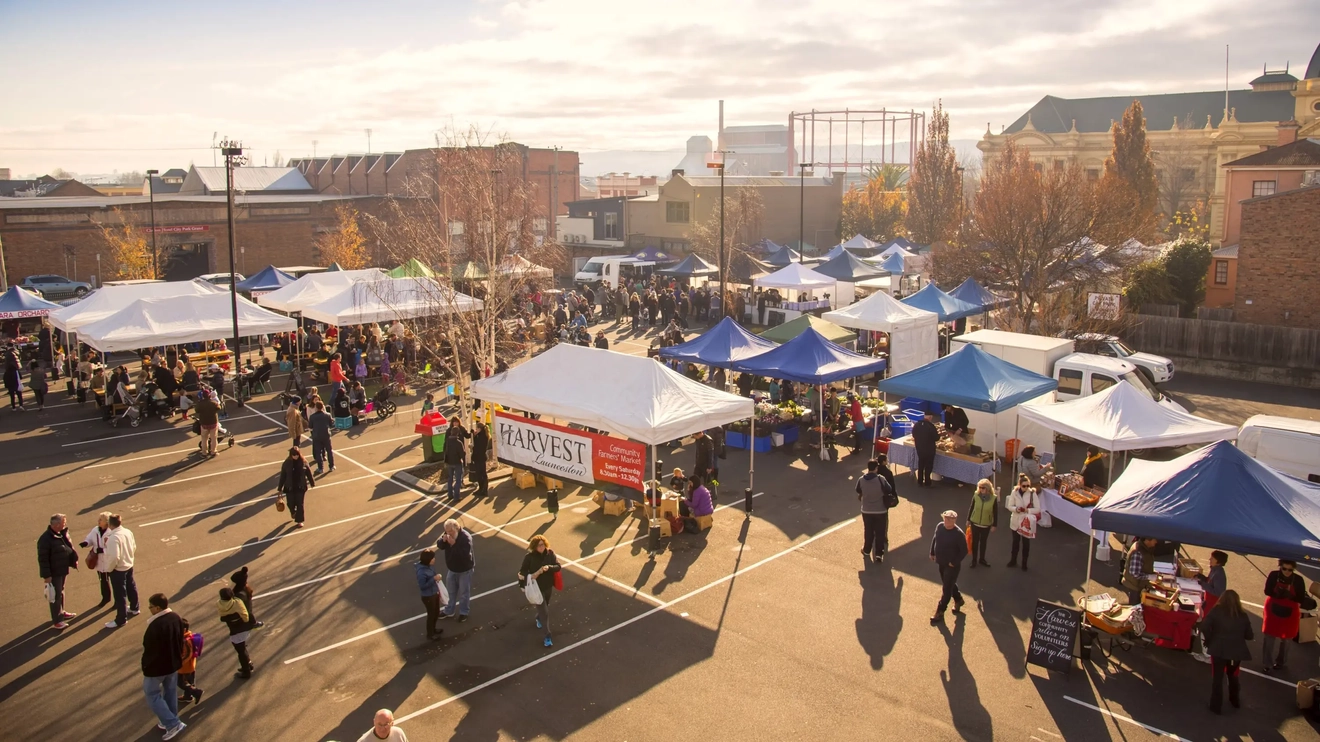 Aerial shot of people browsing stalls at Harvest farmers market. Image credit: Tourism Tasmania/Rob Burnett