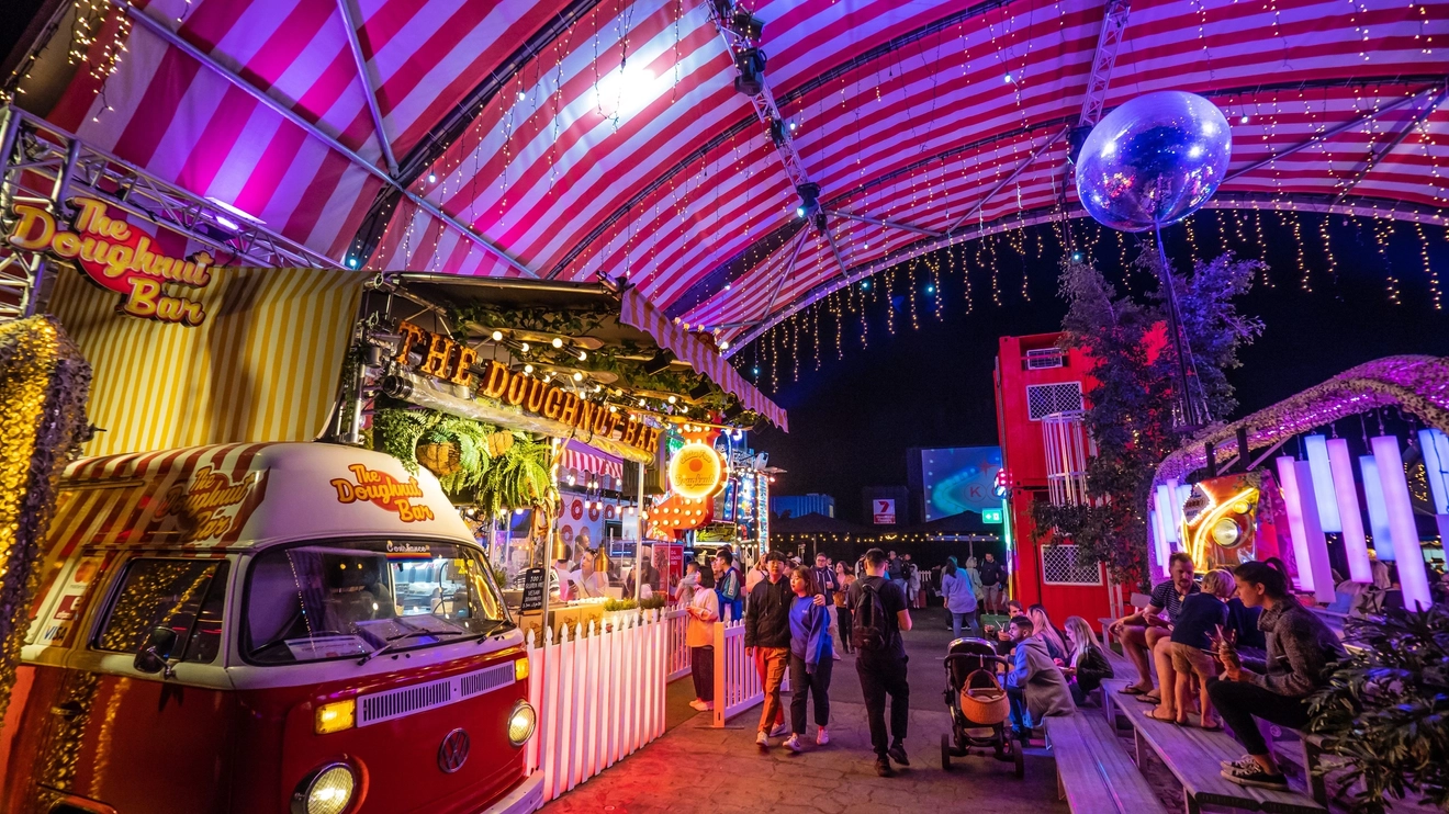 Stalls and diners at Eat Street Northshore at night, Brisbane. Image credit: Tourism and Events Queensland