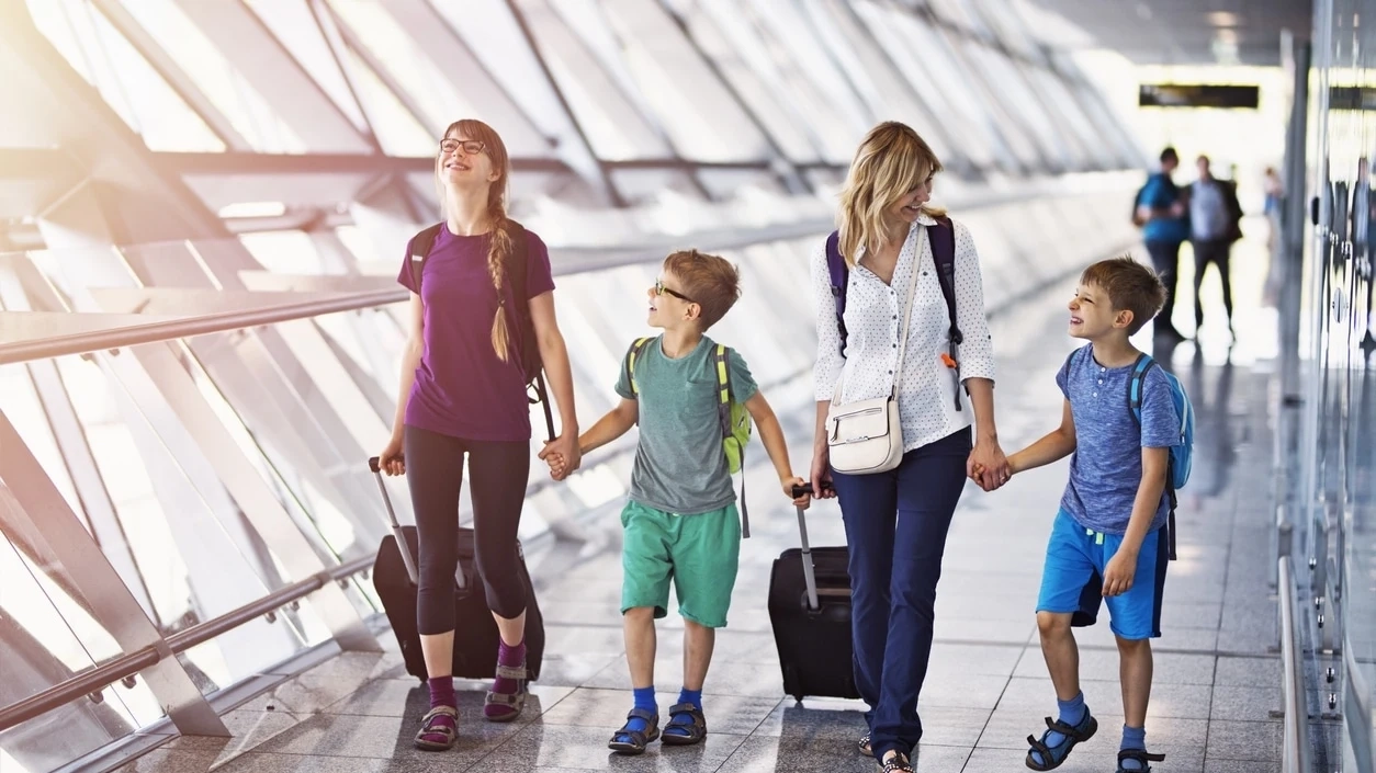 Family walking through the airport