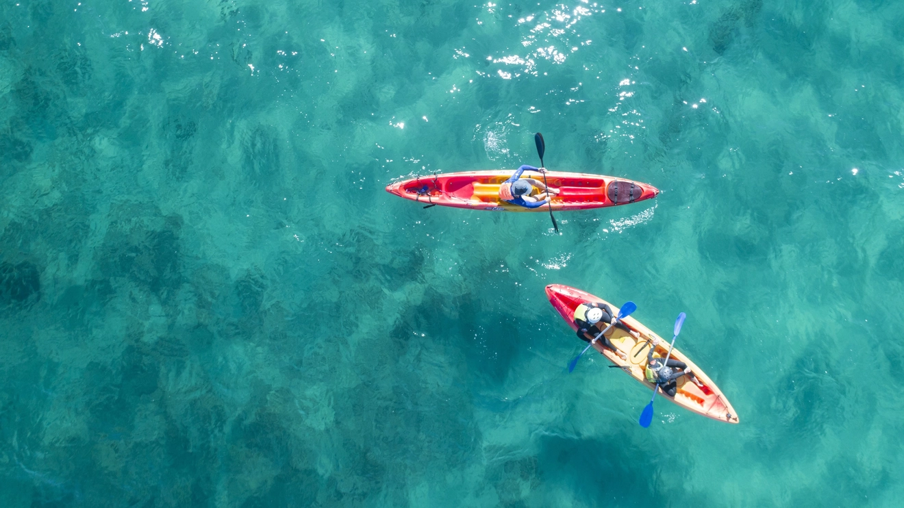 Aerial shot of two kayaks in the water. Image credit: Destination NSW