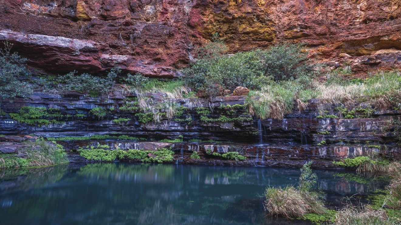 Circular Pool in Karijini National Park, surrounded by ancient red rock face. Image: Tourism Western Australia.