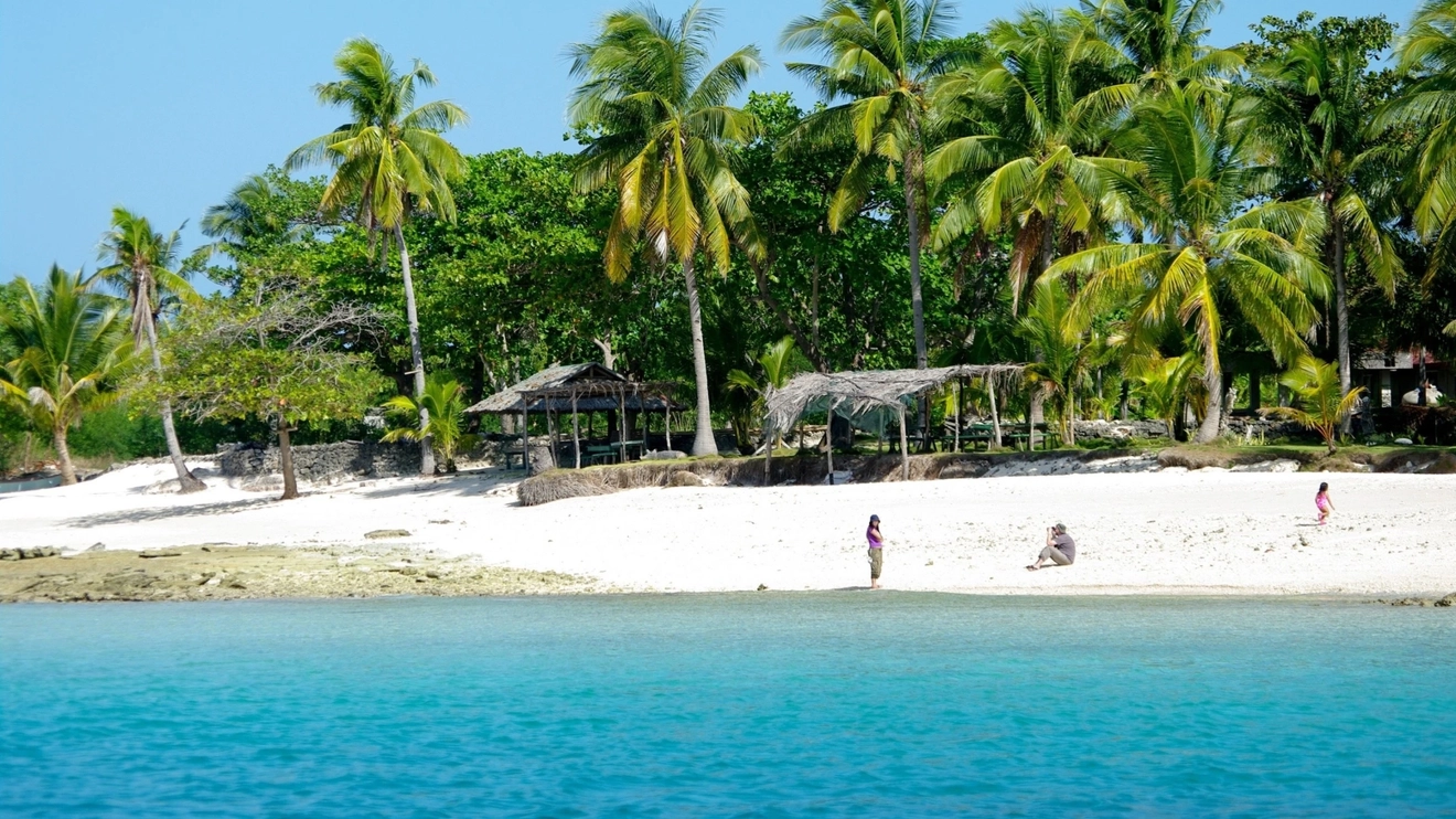 Bantayan's heavenly Virgin Beach, with palm trees, silky sand and bright blue water. Image credit: stock.adobe.com