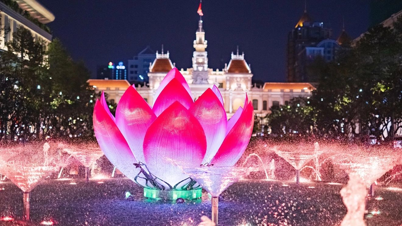 Beautiful lotus water feature in front of Ho Chi Minh City People's Committee, Nguyen Hue Walking Street, evening. Image credit: stock.adobe.com