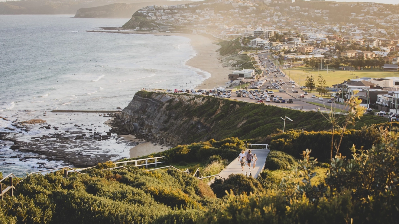Family enjoying a walk along the Newcastle Memorial Walk, The Hill. Image credit: Destination NSW
