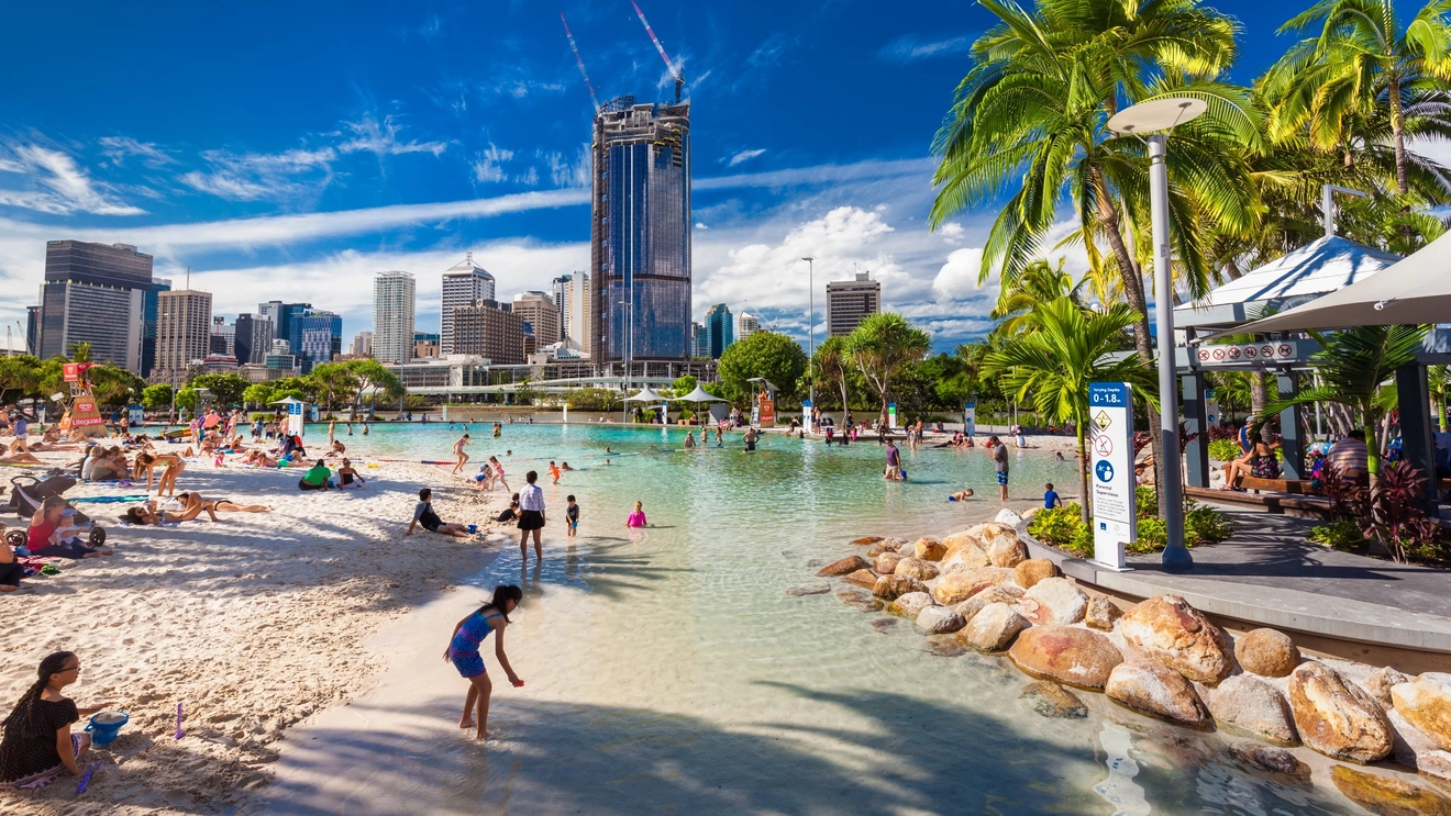 People playing in the water and on the sand at man-made Streets Beach, South Bank, Brisbane. Image credit: Martin Valigursky/Shutterstock.com