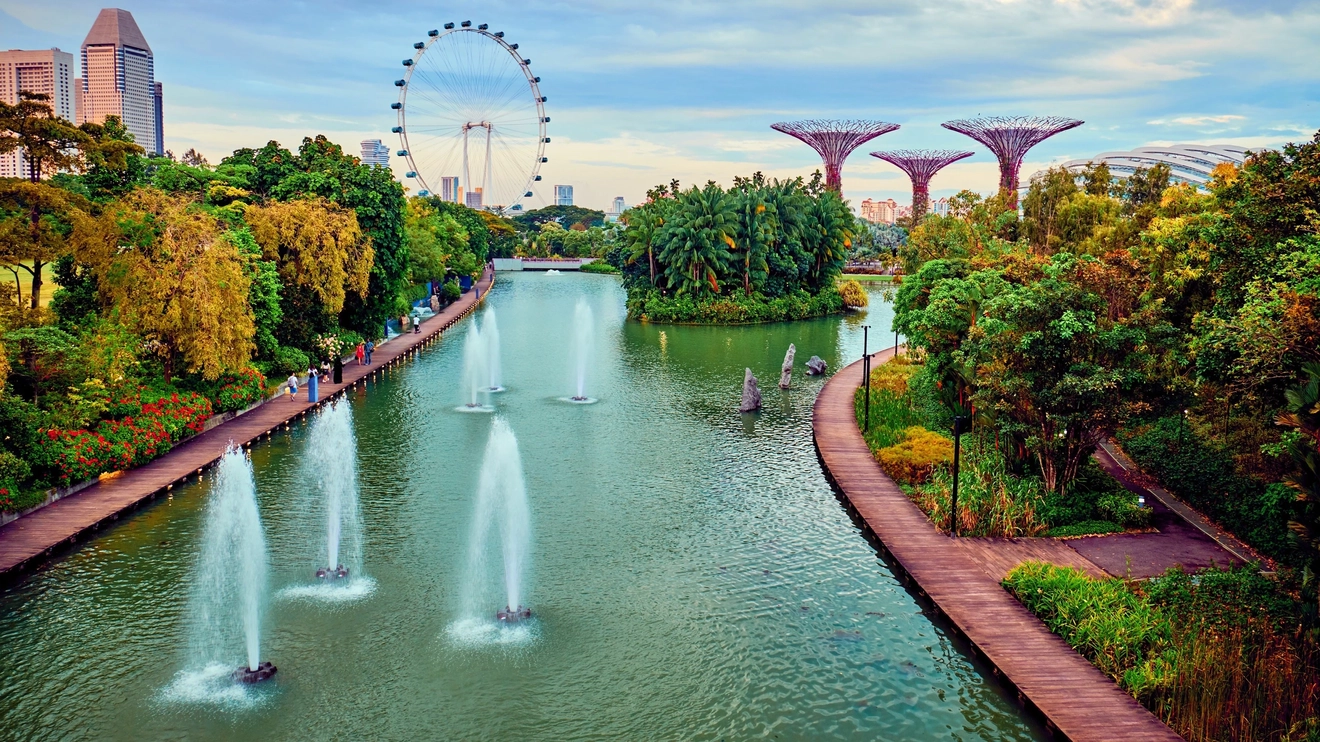 Aerial view of Gardens by the Bay, with fountains in the river and gardens lining the riverbank, Singapore. Image credit: stock.adobe.com