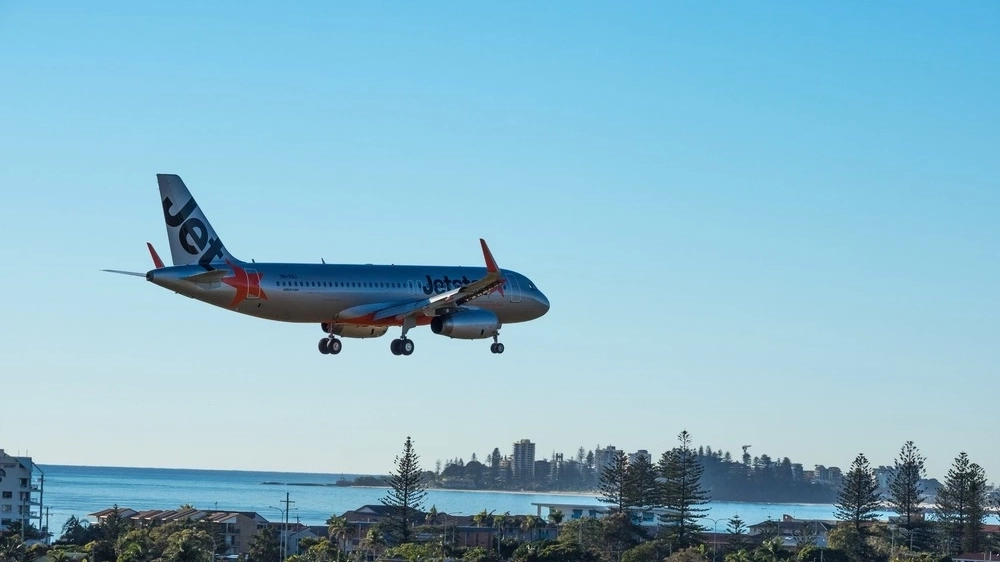 A Jetstar plane approaches Gold Coast airport.