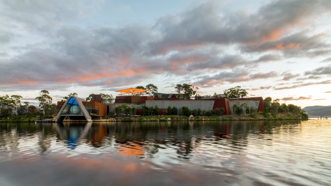 Exterior view of Mona on the banks of the Derwent River, Hobart. Image credit: Tourism Tasmania/Jesse Hunniford