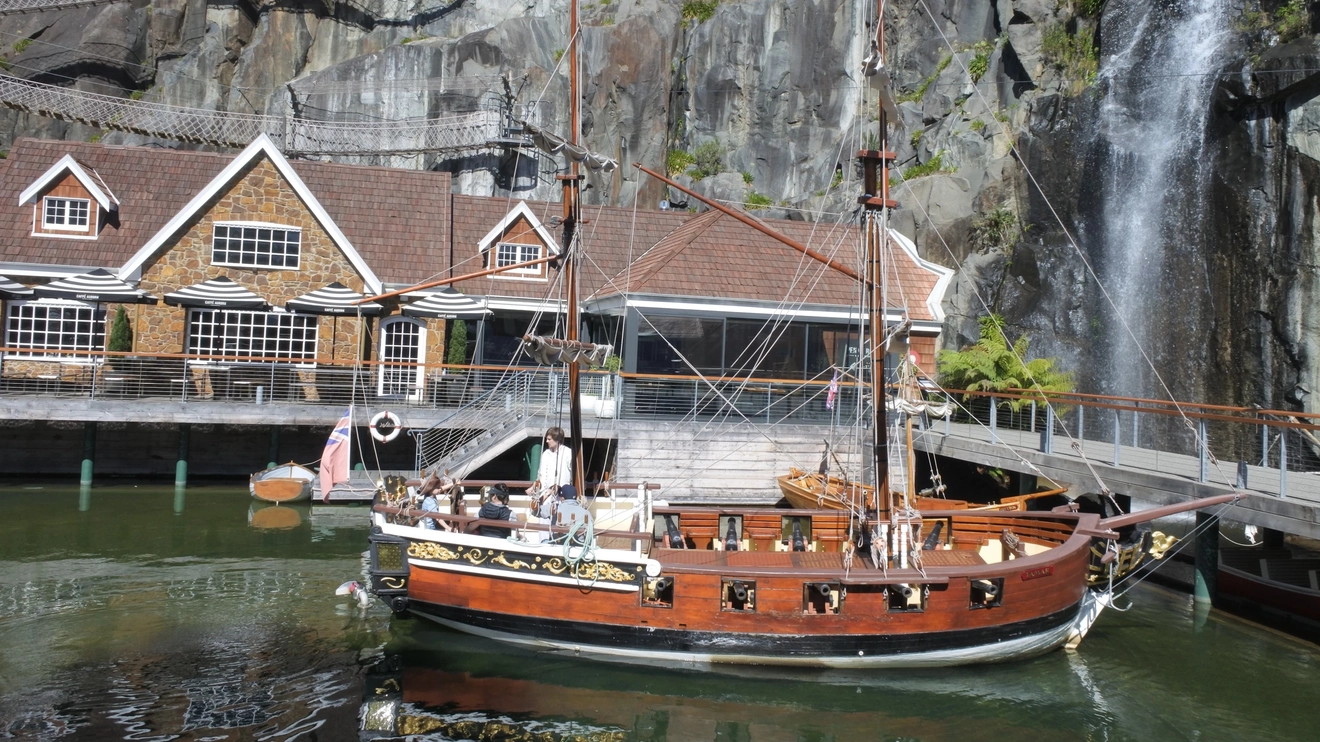 A boat moored next to a cliff face at Penny Royal Adventures, Launceston. Image credit: ChameleonsEye/Shutterstock.com