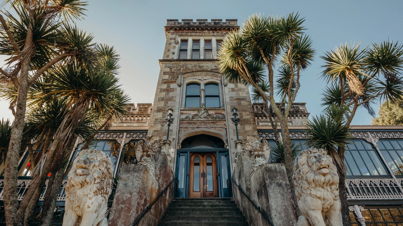 Stone lions flank the stairs to the entrance of Larnach Castle, Dunedin, New Zealand. Image credit: stock.adobe.com
